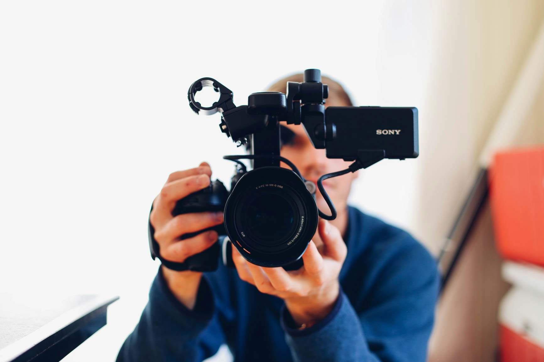 Videographer working behind a Sony video camera